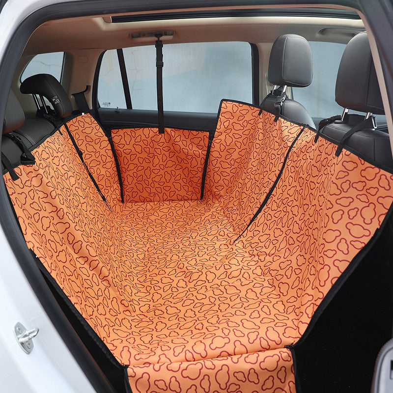 Orange FurBuddy waterproof dog car seat cover installed in a car